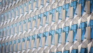Sun shades attached to building windows.